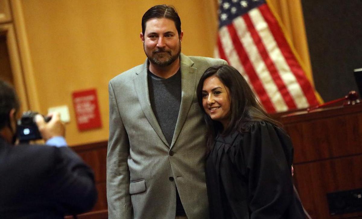 Irene Luna poses for a photo with her husband, Louie, after she was sworn in as a Fresno County Superior Court Judge on Dec. 13, 2021.