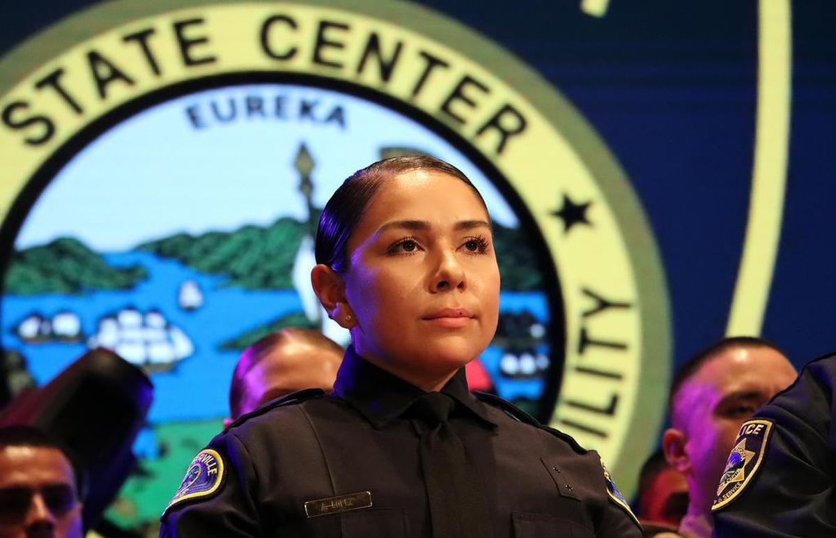 Adelita López, who joins the Porterville Police Department, takes part in the completion ceremony of the State Center Community College District Police Academy at CrossCity Church.