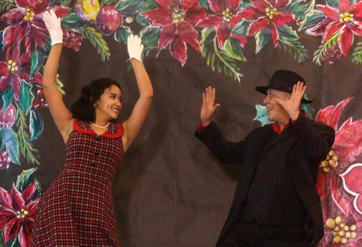 Sophie Velásquez and Franco Peraza dance to ‘Zoot Suit Boogie’ during the 47th Fiesta Navideña Fashion Show at Fresno Fields on Dec. 4, 2022. The fundraiser was sponsored by the League of Mexican American Women.