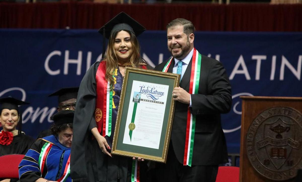 California State University Trustee Yammilette Rodríguez was given a state Assembly proclamation by Assemblymember Joaquín Arámbula during the 46th anniversary of the Fresno State Chicano/Latino Commencement Celebration at the Save Mart Center on May 21, 2022.