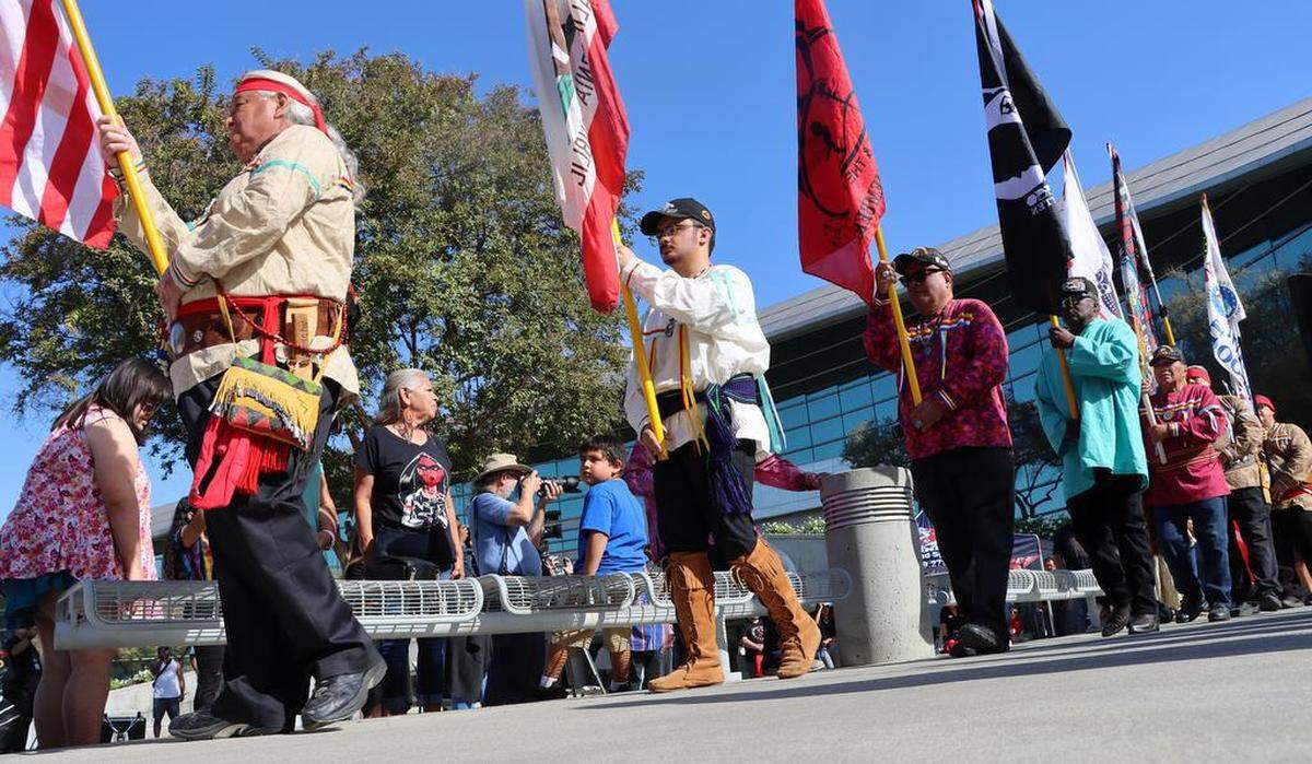 Tribal members present the flags during the third annual Indigenous Peoples Day celebration at Fresno City Hall on Oct. 10, 2022.