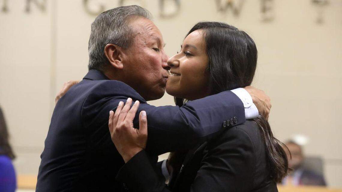 Fresno City Council Vice President Annalisa Perea gets a hug from father Henry R. Perea after being sworn in at City Hall on Jan. 5, 2023.