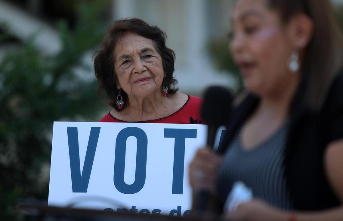 Dolores Huerta listens to Imelda Cruz speak during a Sept. 7, 2021 downtown Fresno rally calling for a no vote on the Gov. Gavin Newsom recall election.