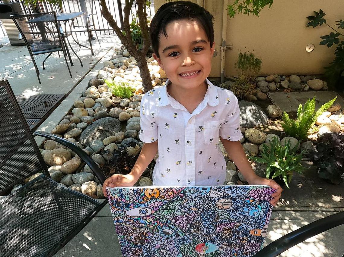 Emilio Barrera, 6, shows the drawing that fetched $904 on the NFT marketplace.