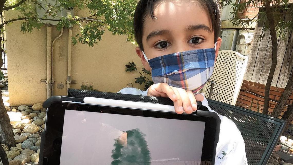 Emilio Barrera, 6, has sold more than $4,000 worth of his art as NFTs. He donates 10% to the Poverello House.