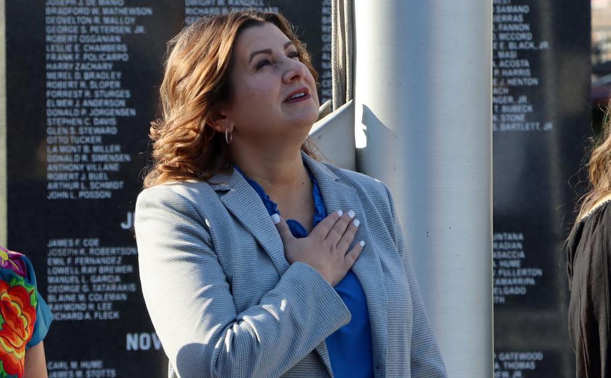 Fresno City Manager Georgeanne White participates in the national anthem during a celebration of the 212th anniversary of México's independence during a Sept. 15, 2022 ceremony at Fresno City Hall.