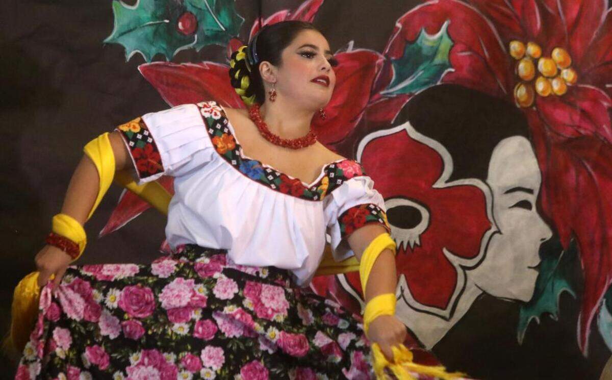 A dancer with Los Niños de Aztlán dances during the 47th Fiesta Navideña Fashion Show at Fresno Fields on Dec. 4, 2022. The fundraiser was sponsored by the League of Mexican American Women.