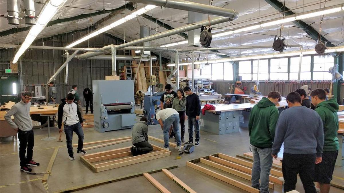 Dinuba High School students work on framing during their construction management academy.