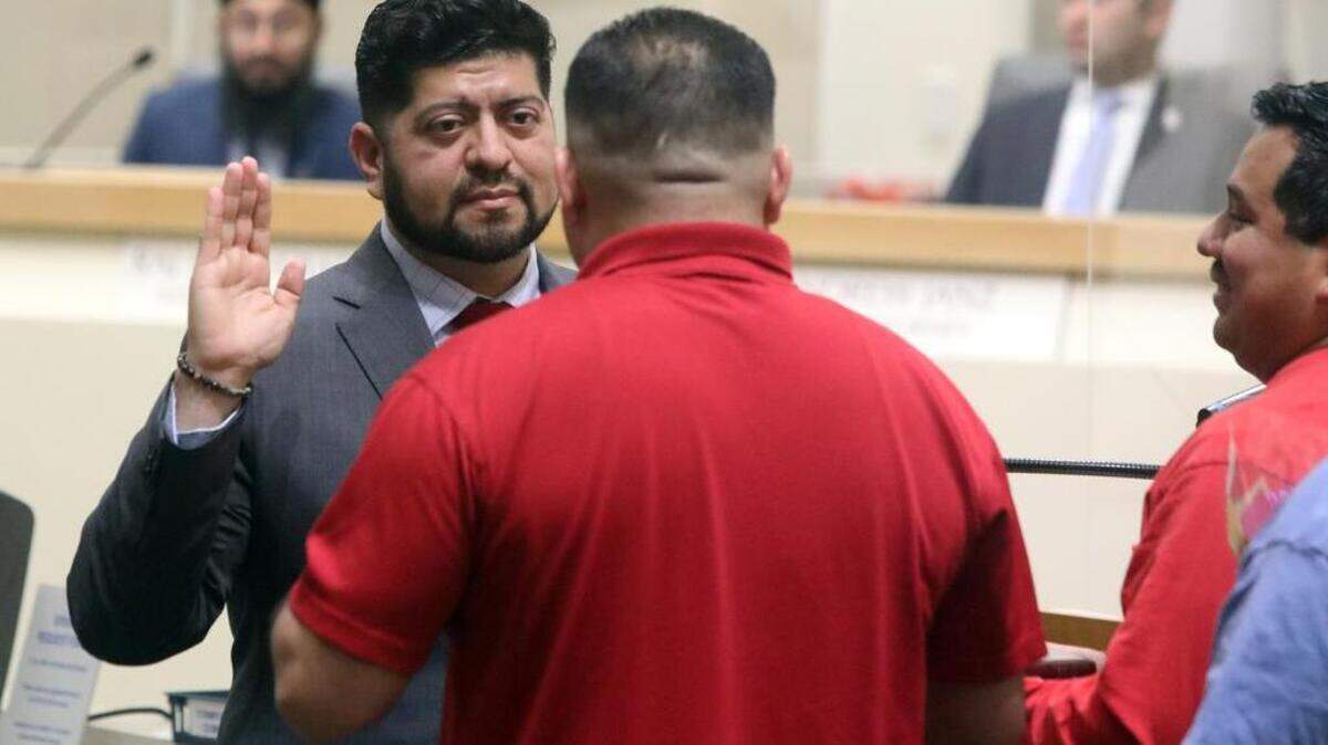 Luis Chávez is sworn in to his second term on the Fresno City Council by members of the Fresno iron workers union at City Hall on Jan. 5, 2023.