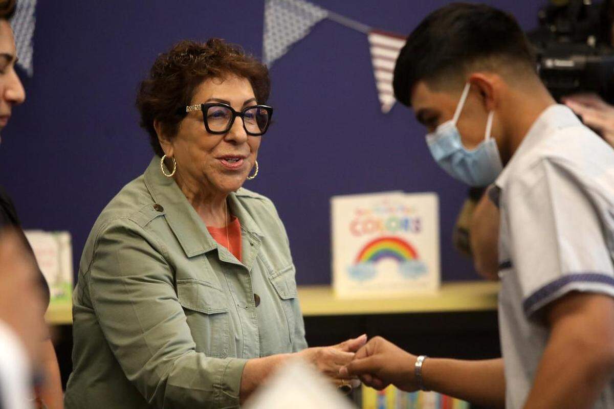 Citizenship ambassador Margarita Rocha congratulates a new U.S. citizen during Sept. 16, 2022 ceremony at the Betty Rodriguez Regional Library.
