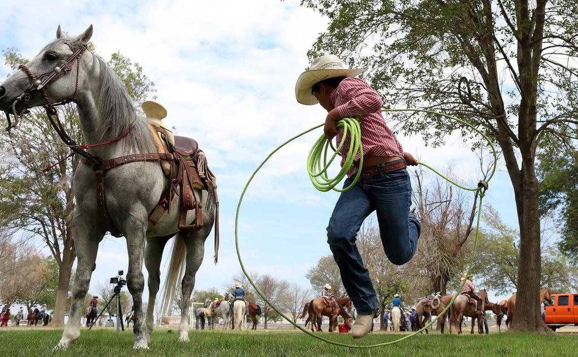 Luis Flores, 11, practices his trick roping skills at Lindgren-Lozano Park in Mendota on July 30, 2022.
