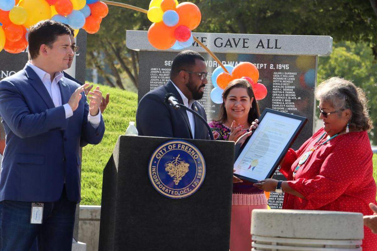 Fresno City Councilmember Tyler Maxwell and Mexican chief consul Adriana González Carrillo look on as Council President Nelson Esparza gives Choinumni tribal historian Audrey Osborne a proclamation during the third annual Indigenous Day celebration at Fresno City Hall on Oct. 10, 2022. On far left is Bryce Herrera, and Councilmember Tyler Maxwell is on far right.