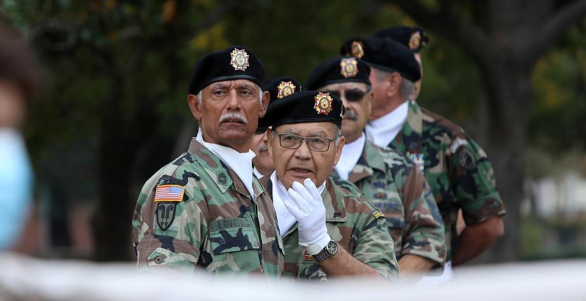 Members of the VFW Post 8900 honor guard wait for the Fresno Veterans Day Parade to start on Nov. 11, 2021.