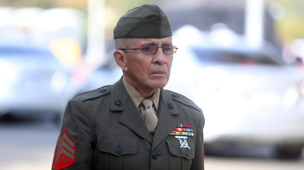 Marine veteran Henry Rentería marches alone for the 33rd year in the Fresno Veterans Day Parade in downtown Fresno on Nov. 11, 2022.