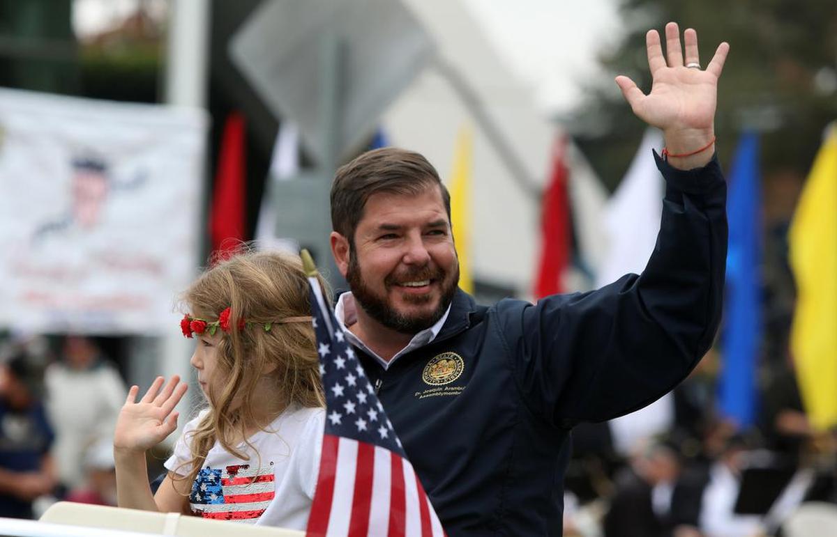 Assemblymember Joaquín Arámbula waves during the Central Valley Veterans Day Parade on Nov. 11, 2021.