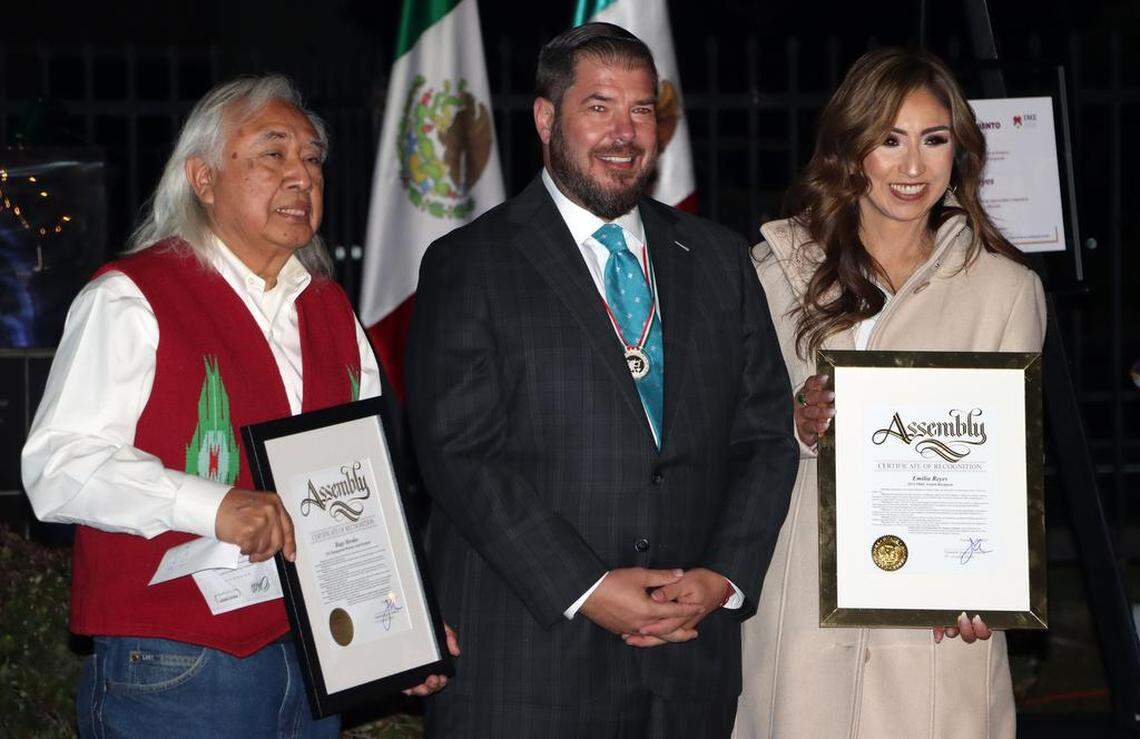 Hugo Morales of Radio Bilingüe and Emilia Reyes of the Fresno Economic Opportunities Commission, who were honored at the Mexican Consulate in Fresno on Nov. 18, 2022, pose for a photo with Assemblymember Joaquín Arámbula..