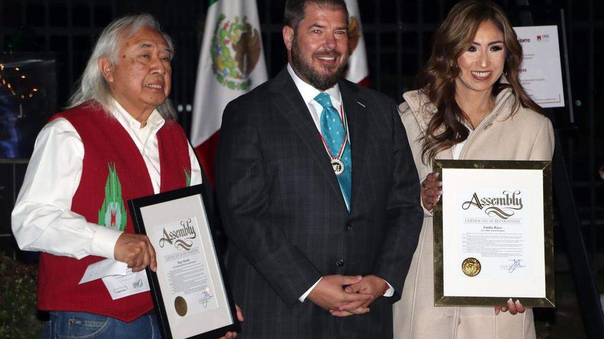 Hugo Morales of Radio Bilingüe and Emilia Reyes of the Fresno Economic Opportunities Commission, who were honored at the Mexican Consulate in Fresno on Nov. 18, 2022, pose for a photo with Assemblymember Joaquín Arámbula..