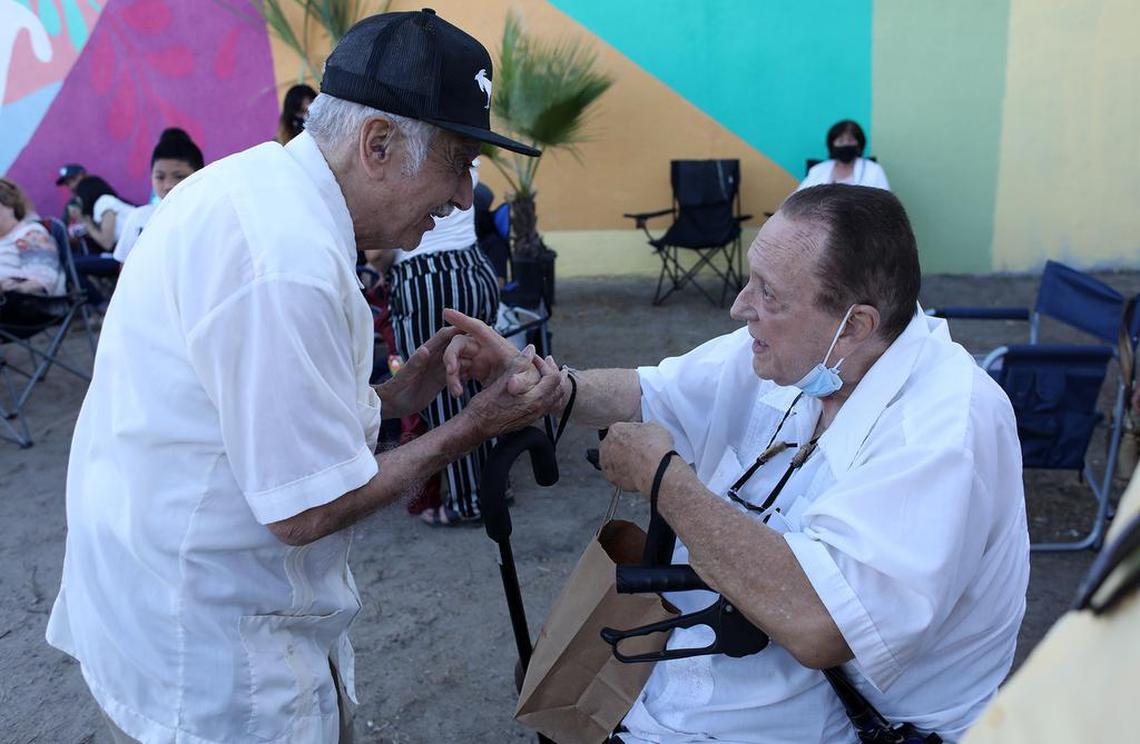 Ernie Palomino chats with former Teatro Campesino member Antonio Bernal.