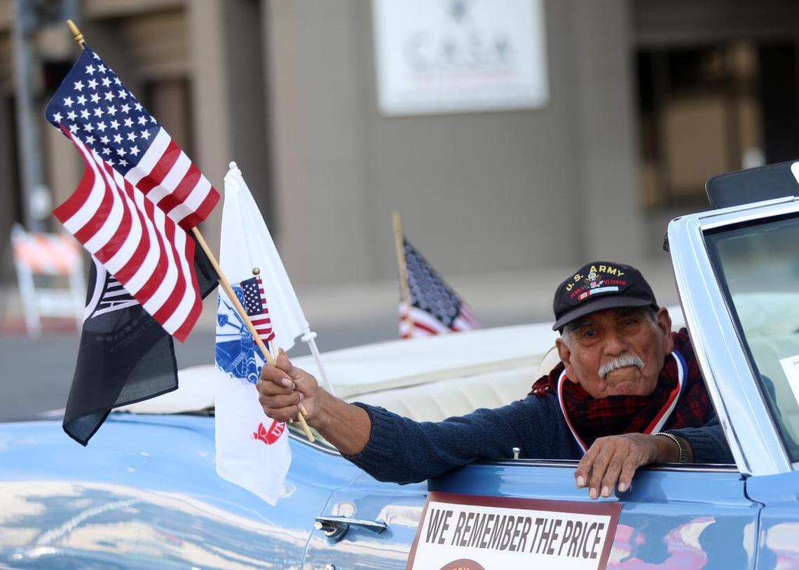 Sam Bañuelos waves to the crowd during the Fresno Veterans Day Parade on Nov. 11, 2022.