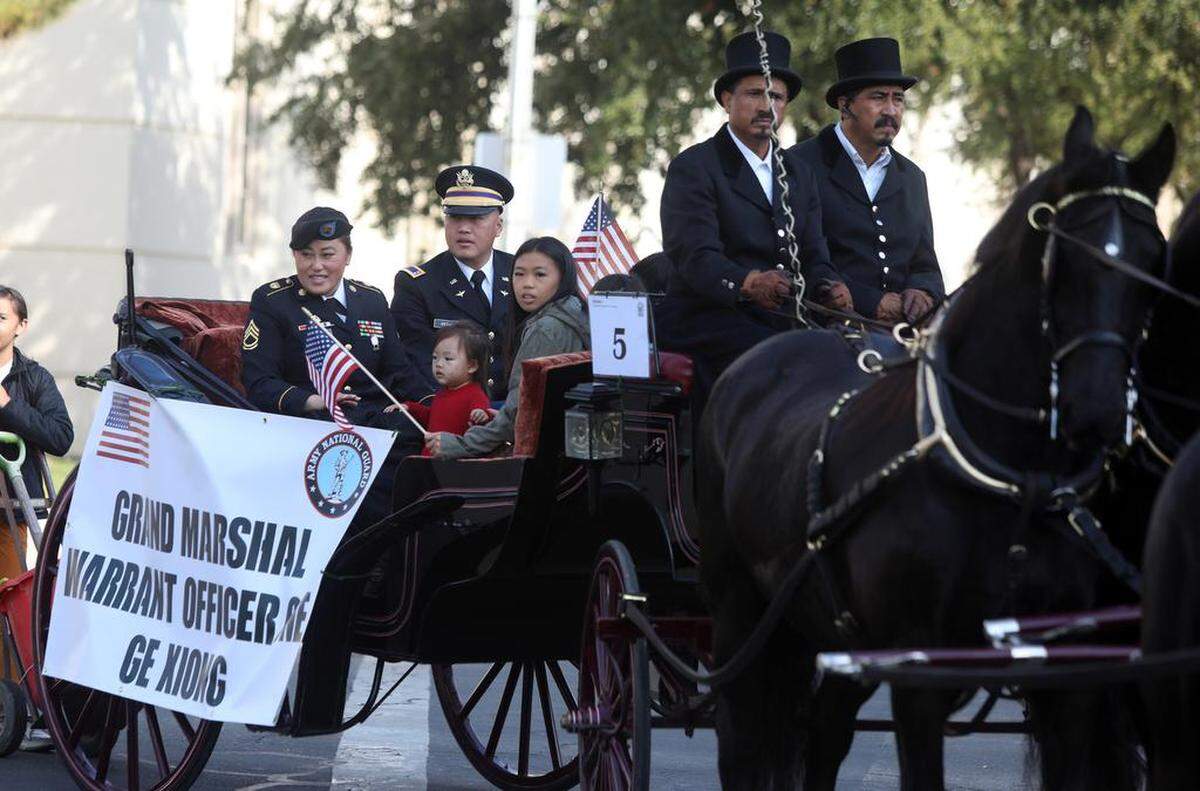 Fresno Veterans Day Parade grand marshall Warrant Officer One Ge Xiong and his family participate in the Veterans Day Parade on Nov. 11, 2022.