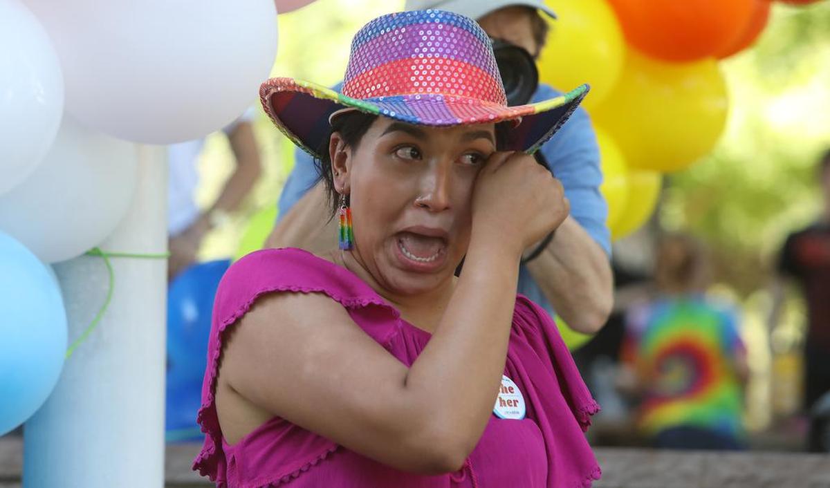 Kingsburg City Councilmember Jewel Hurtado wipes a tear from her eye while listening to Dolores Huerta at the Pride rally attended by more than 250 supporters.