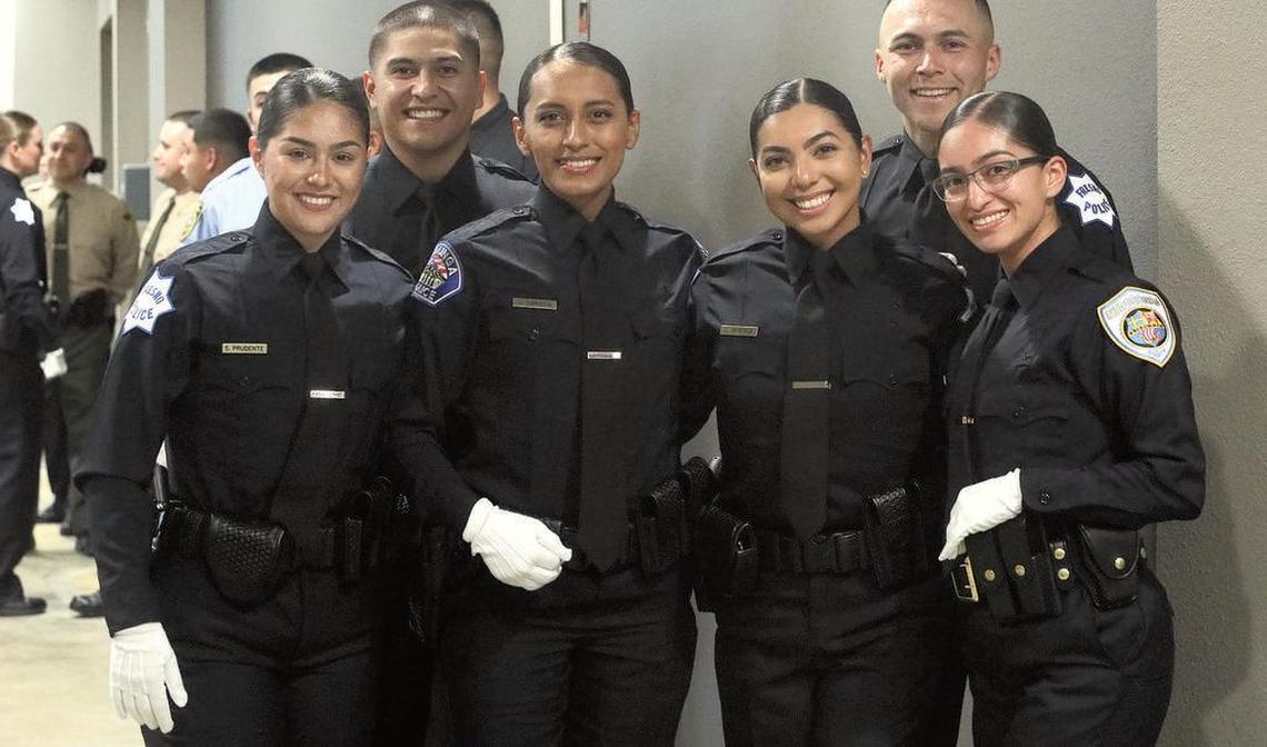 Selenia Prudente Ambriz, Guadalupe Arroyo, Cristal Ramírez and Esteffanni Ramírez wait for the start of the State Center Community College District Police Academy completion ceremony to start.