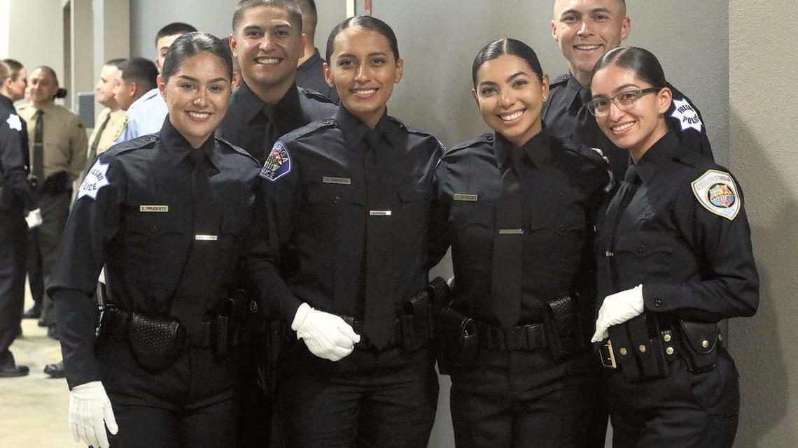 Selenia Prudente Ambriz, Guadalupe Arroyo, Cristal Ramírez and Esteffanni Ramírez wait for the start of the State Center Community College District Police Academy completion ceremony to start at CrossCity Church on March 25, 2022.