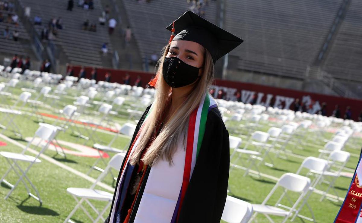 Alejandra Leija, the Fresno State undergraduate dean’s medalist from the Lyles College of Engineering, walks into Bulldog Stadium during the May 16, 2021 commencement.