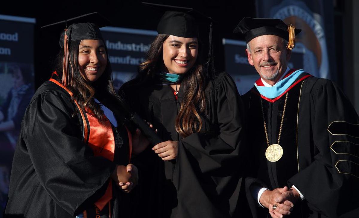 Reedley College held its 94th commencement on May 19, 2022. The Thursday even was for graduates from the Agriculture & Natural Resources, Industrial & Manufacturing Technology & Business pathways. Ariana Olivia Ruiz graduated magna cum laude. At right is trustee Danielle Parra and Reedley College President Jerry L. Buckley.
