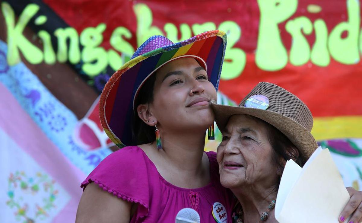 KINGSBURG PRIDE RALLY JE VDA 06/26/21 DOWNTOWN PARK -- Kingsburg City Councilmember Jewel Hurtado hugs community activist Dolores Huerta during the Pride Rally that drew more than 250 people.