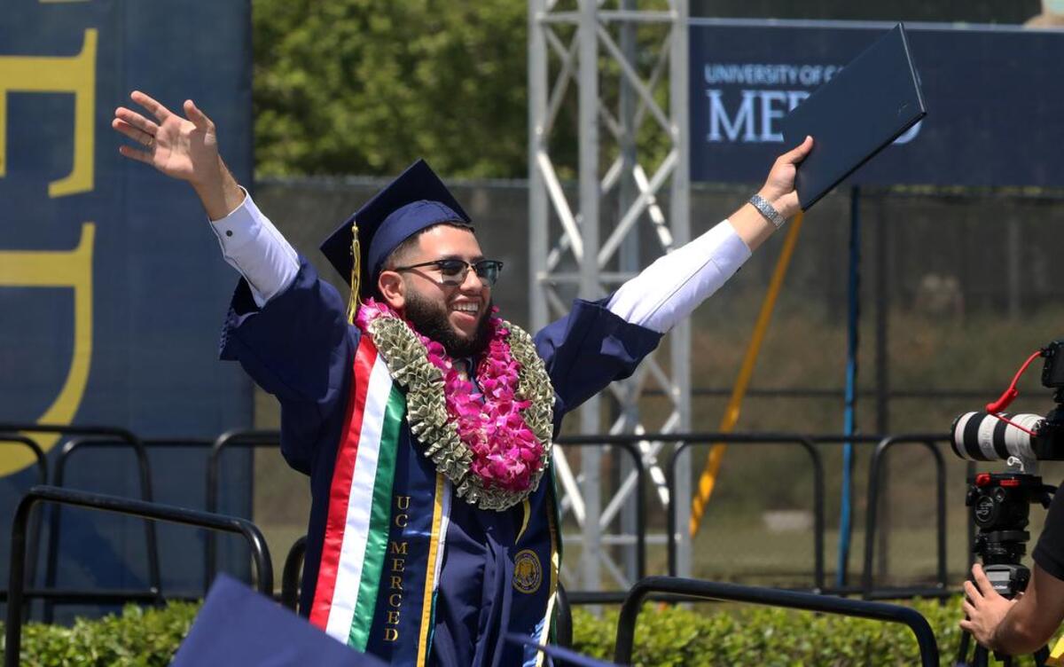 A UC Merced graduate shows his emotions during the May 15, 2022 commencement.