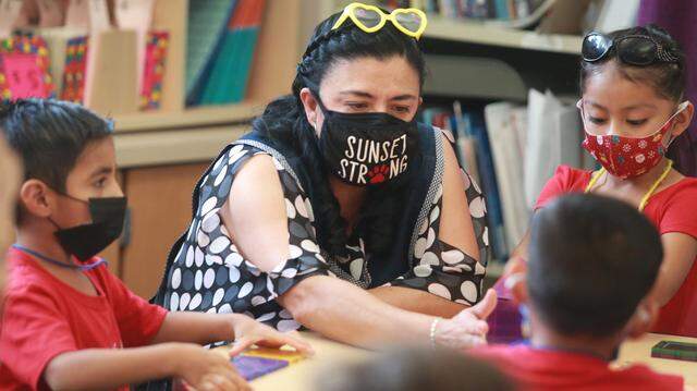 Fresno Unified teachers that take on extra teaching duties beyond their regular classroom work will now receive more money. In this Bee file photo, TK teacher Alma Renteria works with her students at Sunset Elementary School in Fresno, on Tuesday, Oct. 5, 2021.