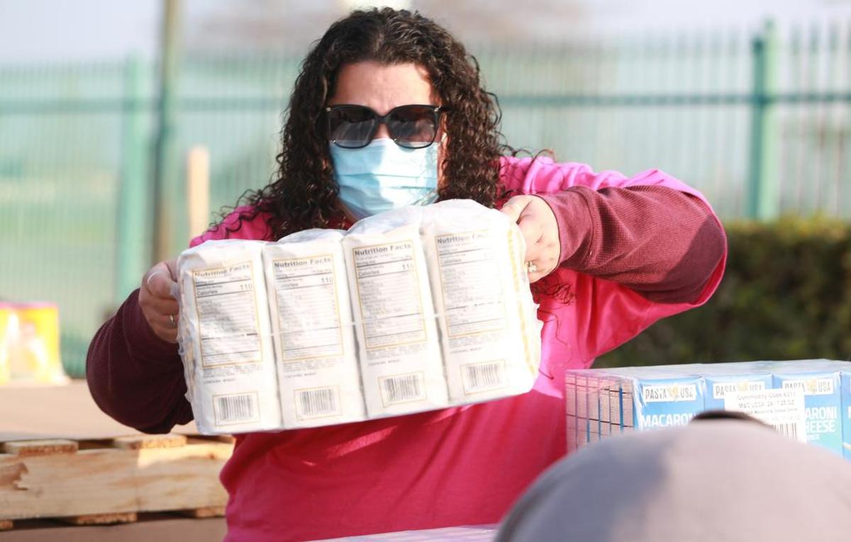 Gabby Romero, community services program manager for Fresno Economic Opportunities Commission. on Jan. 18, during the monthly Fresno EOC’s food distribution site at Orange Cove community center.