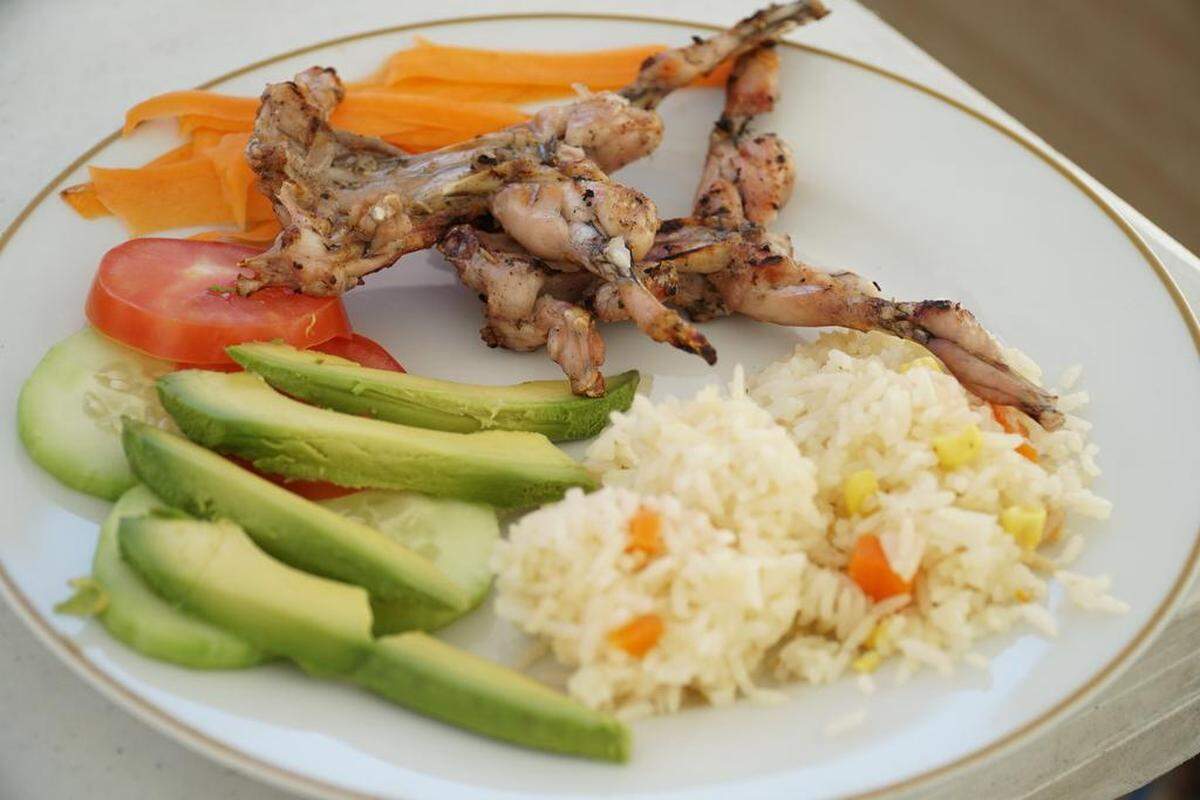 This roasted frog dish, served with rice and avocado, has gained popularity in Oaxaca during the Lenten season.