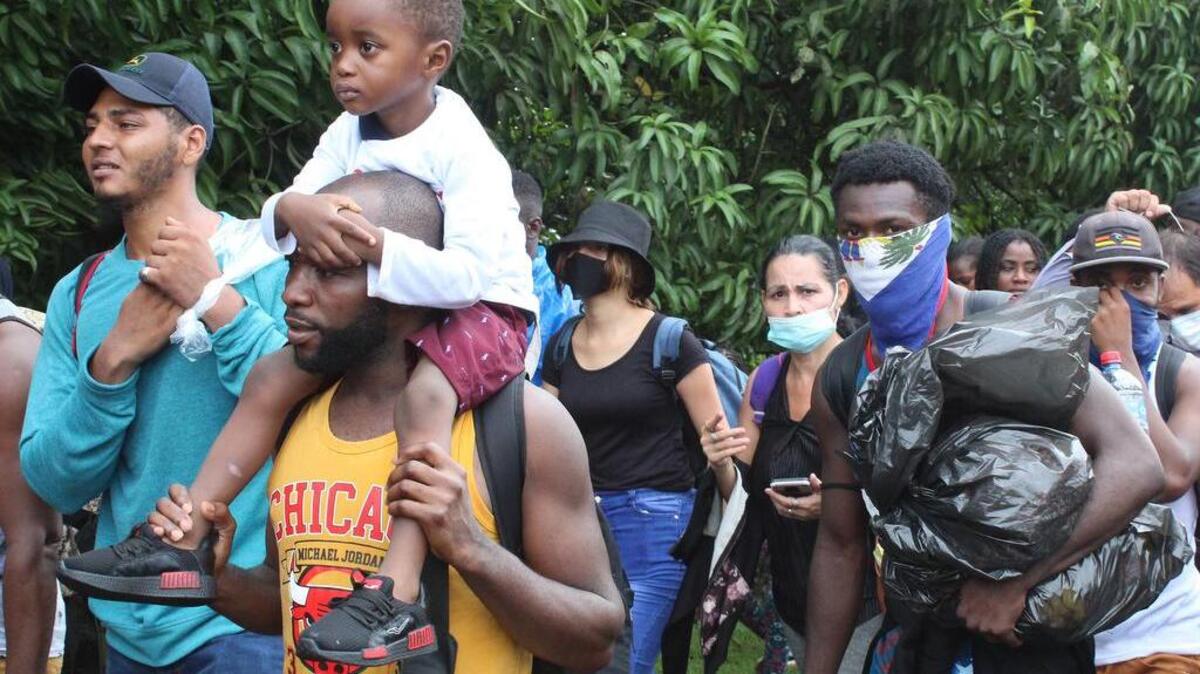 A migrant caravan formed mostly of Hiatians travels on a highway in Tapachula, Chiapas on Sept. 1.