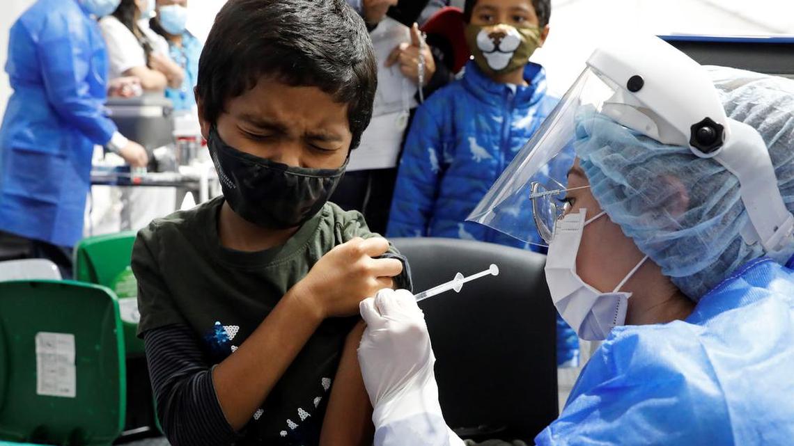 A child receives his first Sinovac dose agaist COVID in Bogotá, Colombia on Oct. 31.