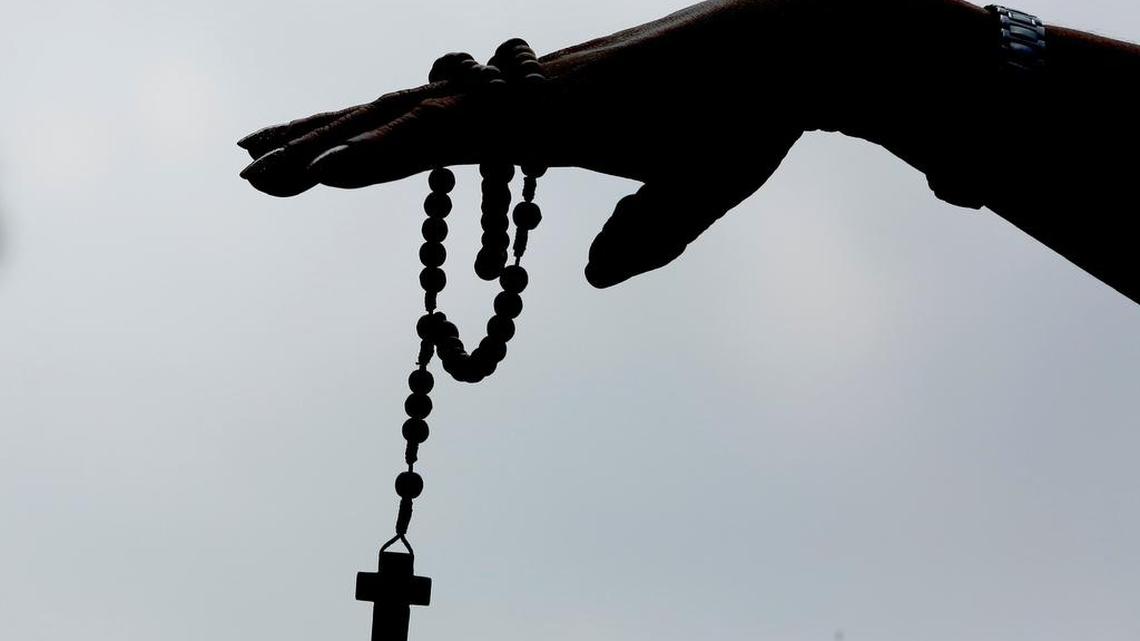 A person holds a rosary during a protest by Catholics in México City on Sept. 7, 2021 after México’s Supreme Court declared unconstitutional the criminalization of women who get an early term abortion.