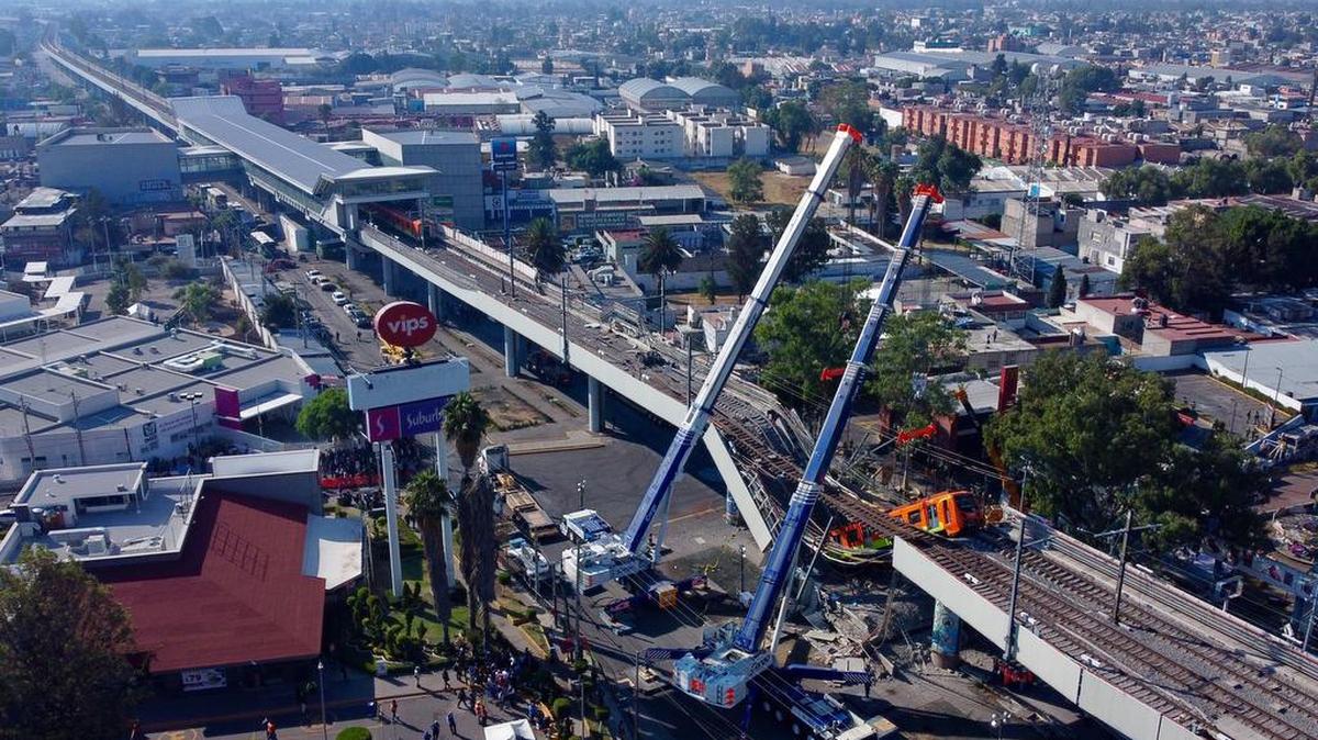 An aerial view shows the Metro subway cars being removed following the May 3 collapse of Line 12. As of Sunday, the death count is 26.