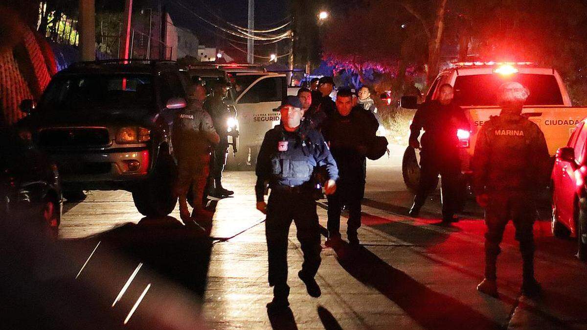 Tijuana police guard the area where a riot of undocumented Venezuelans rioted Wednesday.