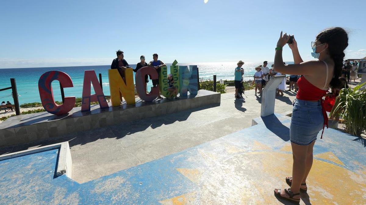 Tourists enjoy their vacation in Cancún in December 2021. Tourism officials expect a big boom in visitors this year.