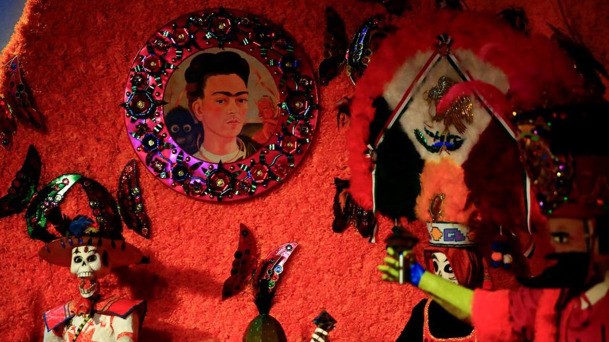 Photograph of a drawing by Mexican artist Frida Kahlo that is part of an offering for the traditional Day of the Dead in the old amusement park of the Chapultepec Fair in México City.