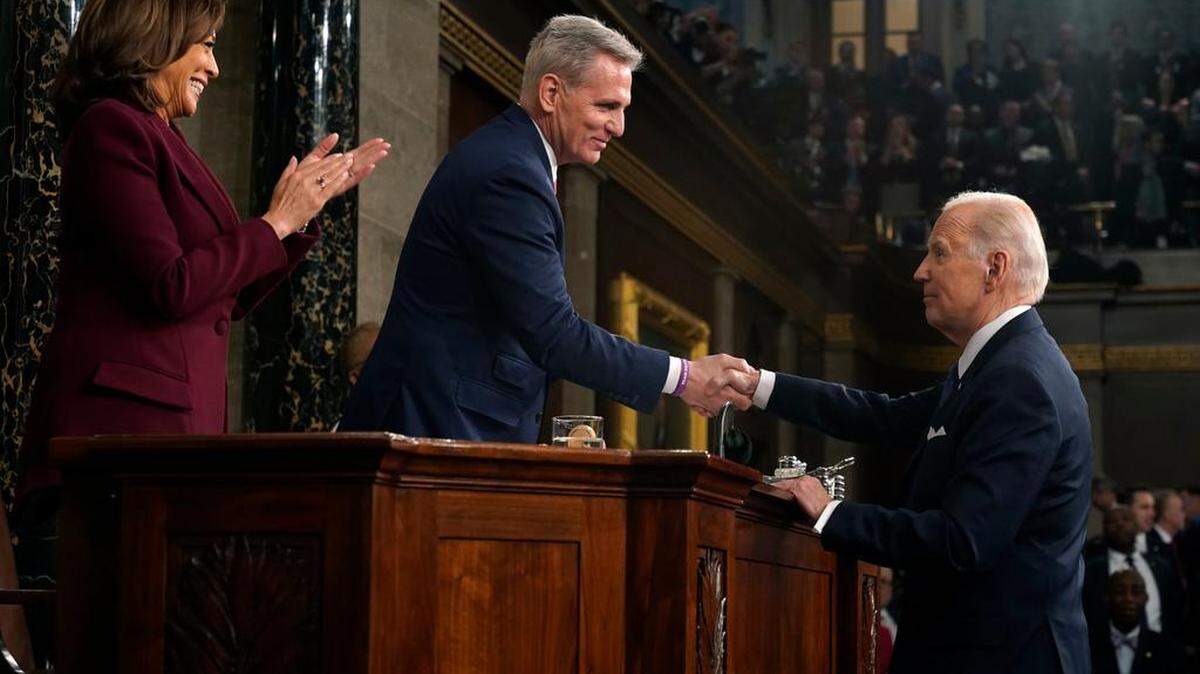 President Joe Biden shakes hands with Speaker Kevin McCarthy