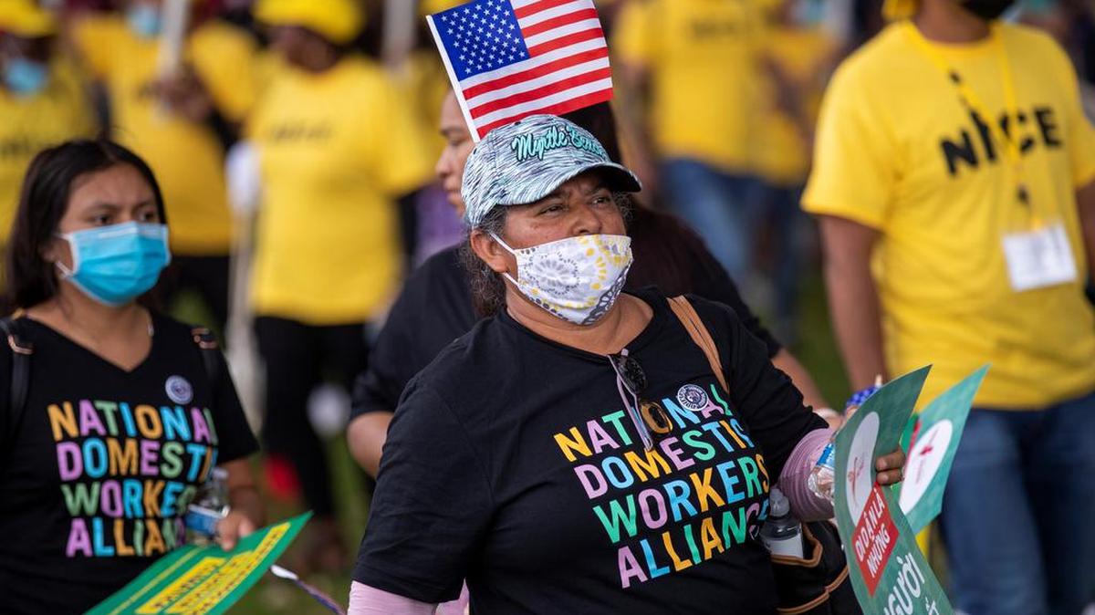 Immigration advocates participate in a #WelcomeBackCongress March in Washington, D.C. The Senate parliamentarian has stimied plans by the Biden administration to include immigration reform using reconciliation.