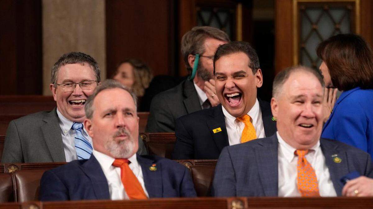 Rep. Thomas Massie, R-Ky., and Rep. George Santos, R-N.Y., laugh before President Joe Biden delivers his State of the Union address before a joint session of Congress in the United States House of Representatives chamber.