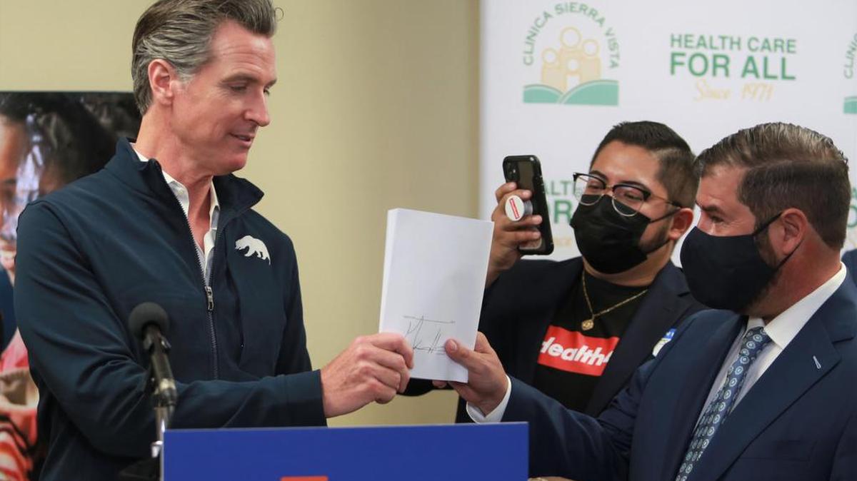 Gov. Gavin Newsom traveled to Fresno on July 27, where he signed a law expanded health care coverage to undocumented people over age 50.
