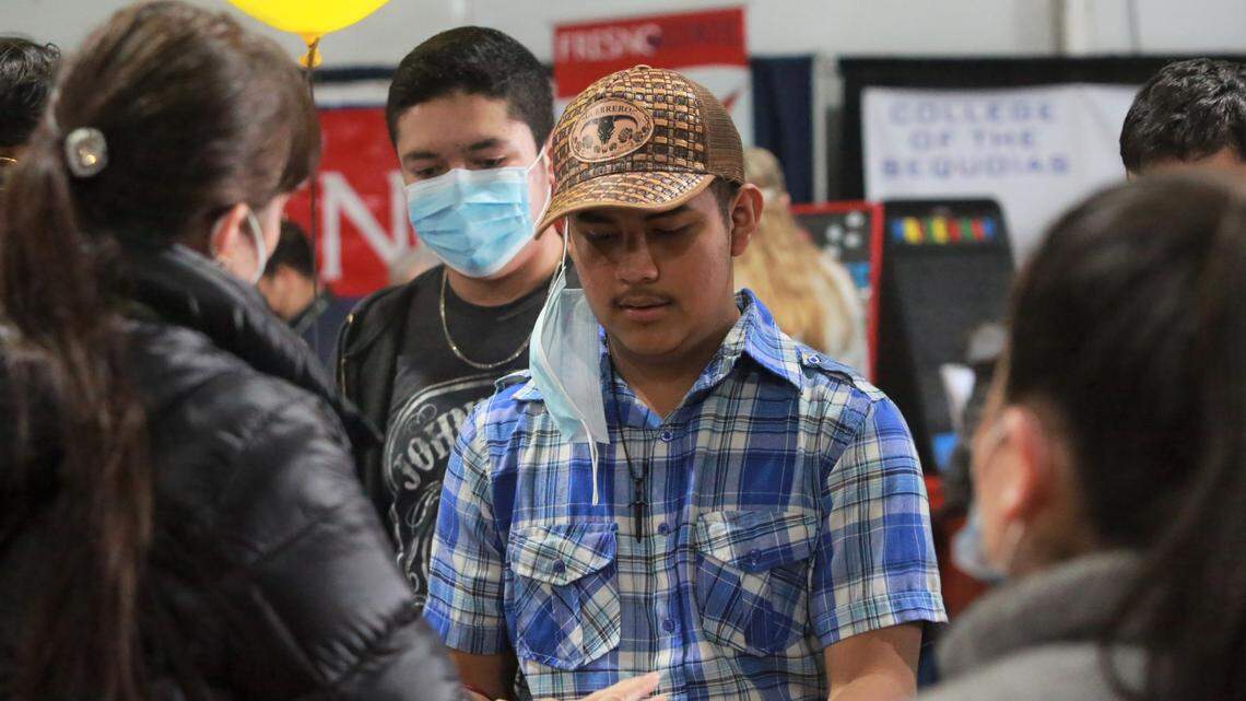 Mendota High School student Tomas Pérez walked around the Ag Career and Education tent at the World Ag Expo on Tuesday, Feb. 8, stopping at different college booths including Stanislaus State. 